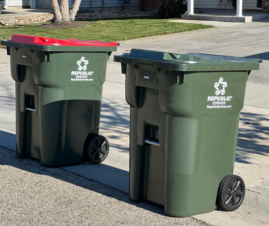 Green trash and recycling carts out at the curb